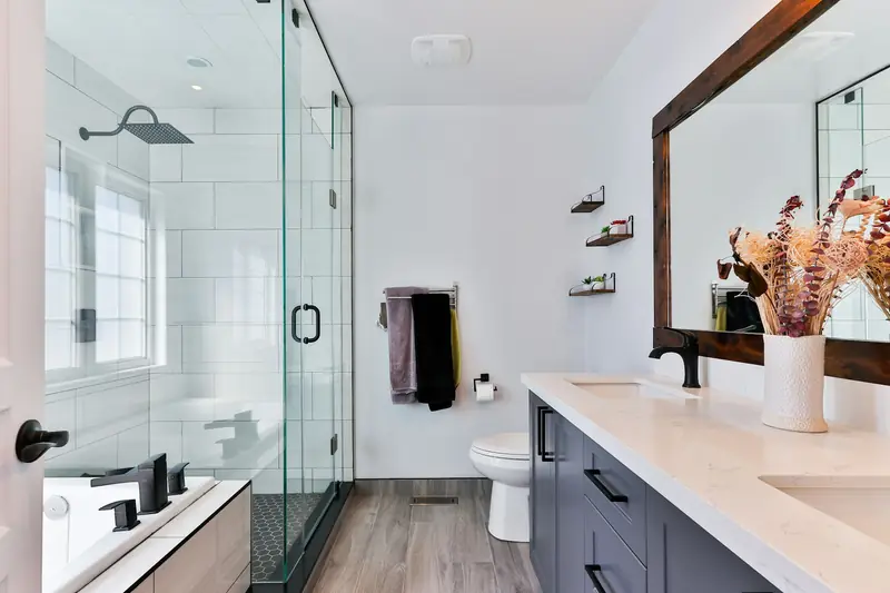 Renovated bathroom with a walk-in glass shower