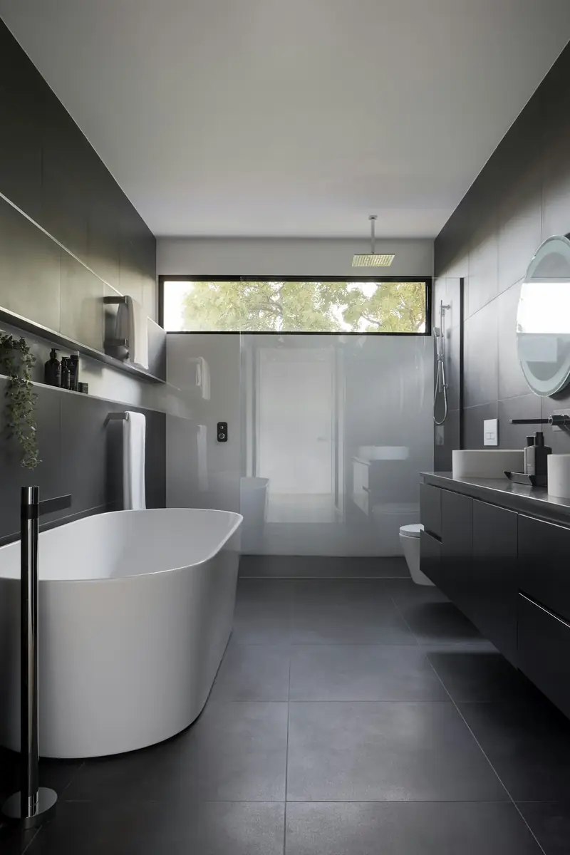 Remodeled bathroom with a freestanding soaking tub
