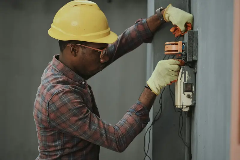 Electrician terminating circuits inside a service panel