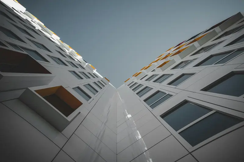 Looking up the facade of a multi-storey building under construction