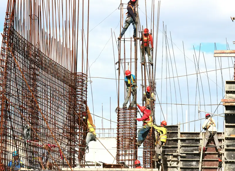 Scaffolding wrapping a high-rise building during a commercial renovation