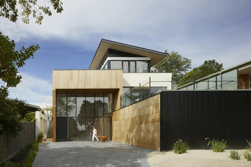 Contemporary home with flat rooflines and a dark facade