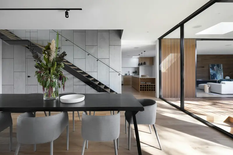 Floating staircase with glass balustrade in a custom home